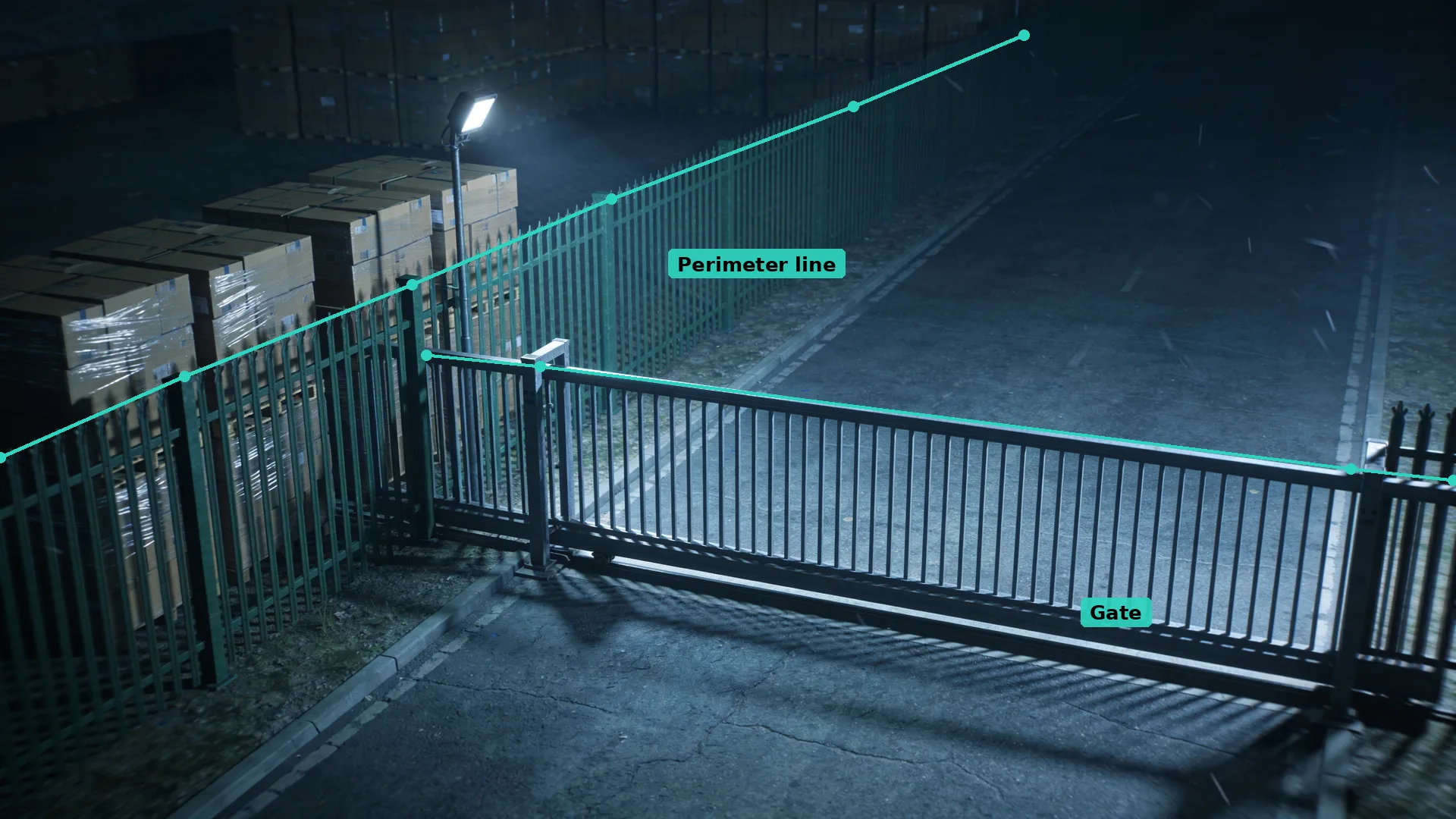 Night CCTV of a green palisade fence and sliding steel gate, with teal virtual lines along the fence top and the gate