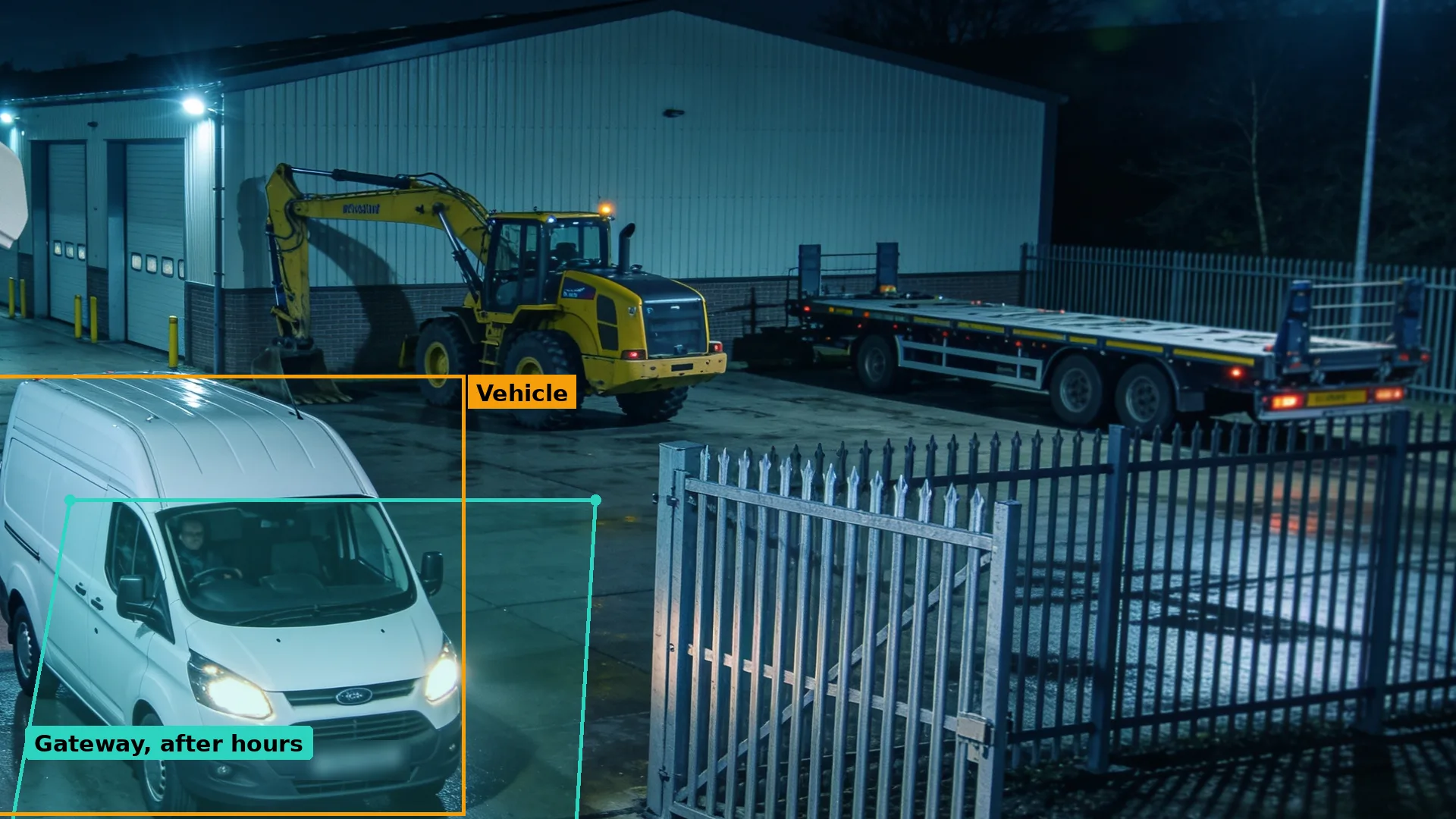 Night CCTV of a white van at the open gateway of a plant depot, an excavator and loader beyond, the van boxed in amber