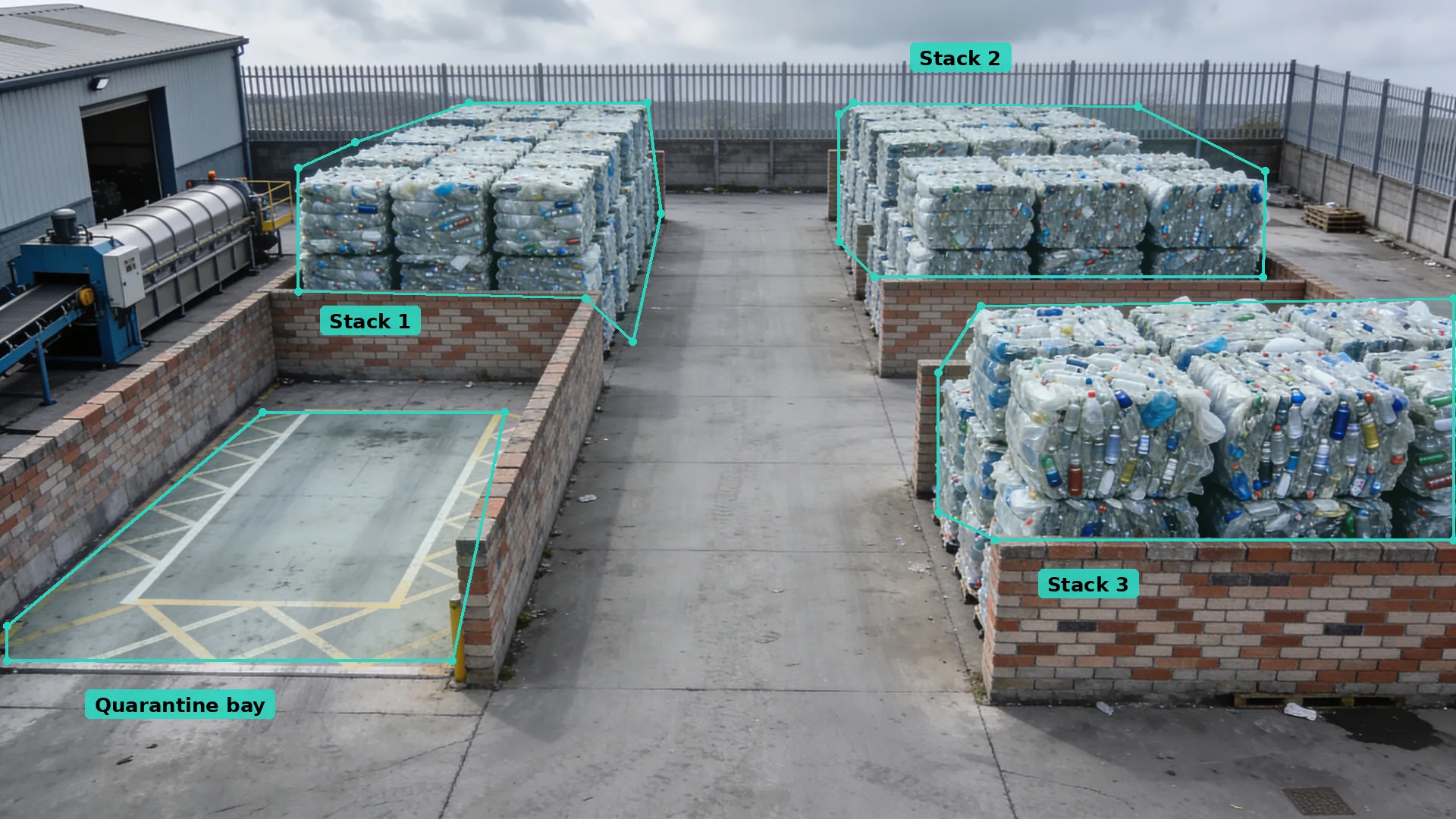 Daytime CCTV of a plastics yard: three interlaced bottle bale blocks in teal zones beside an empty hatched quarantine bay
