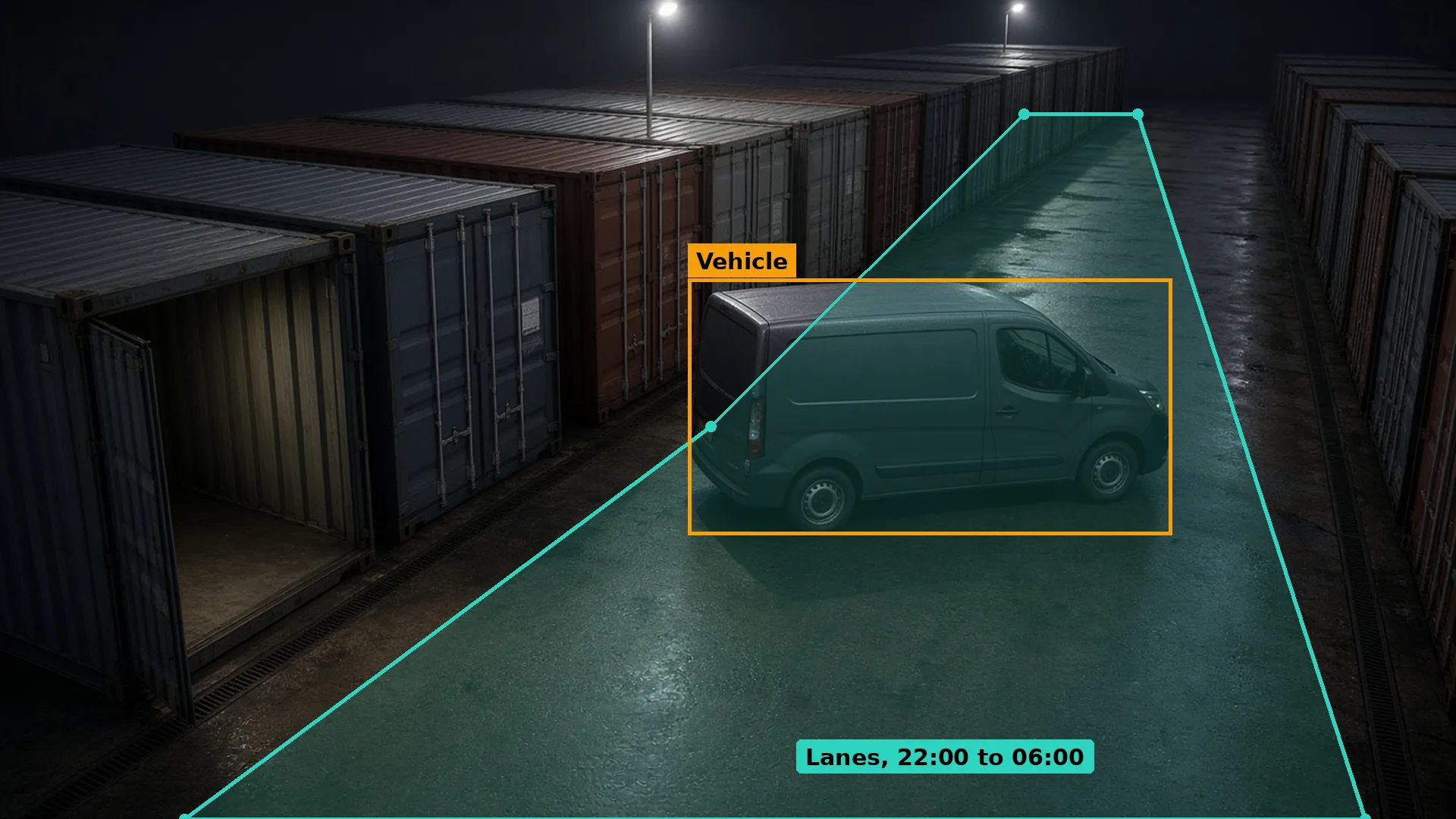 Night CCTV of a van parked between rows of storage containers beside one open container, boxed in amber