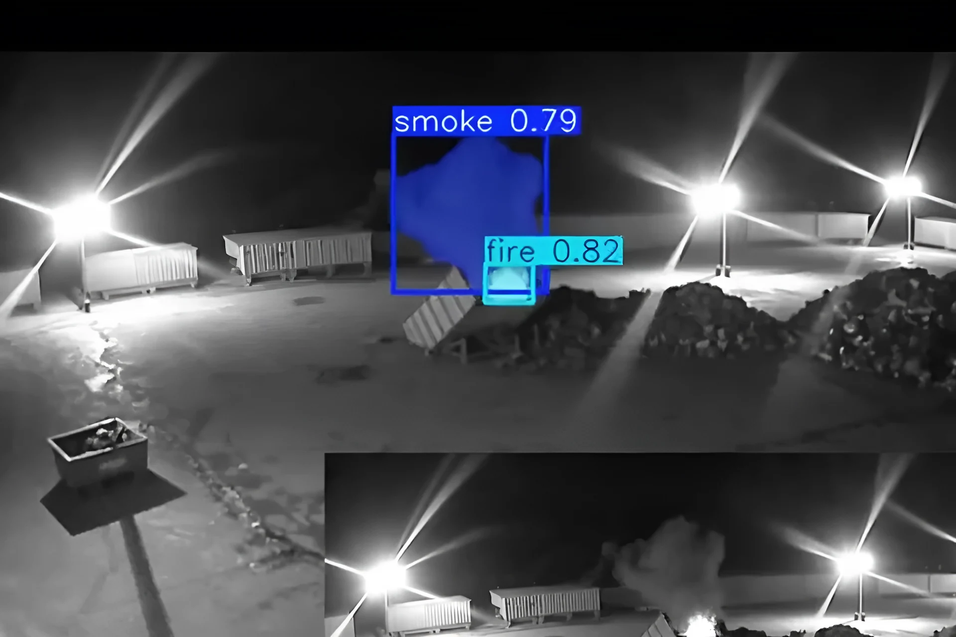 Real night-time infrared CCTV frame of a yard with smoke picked out by Woodcock AI
