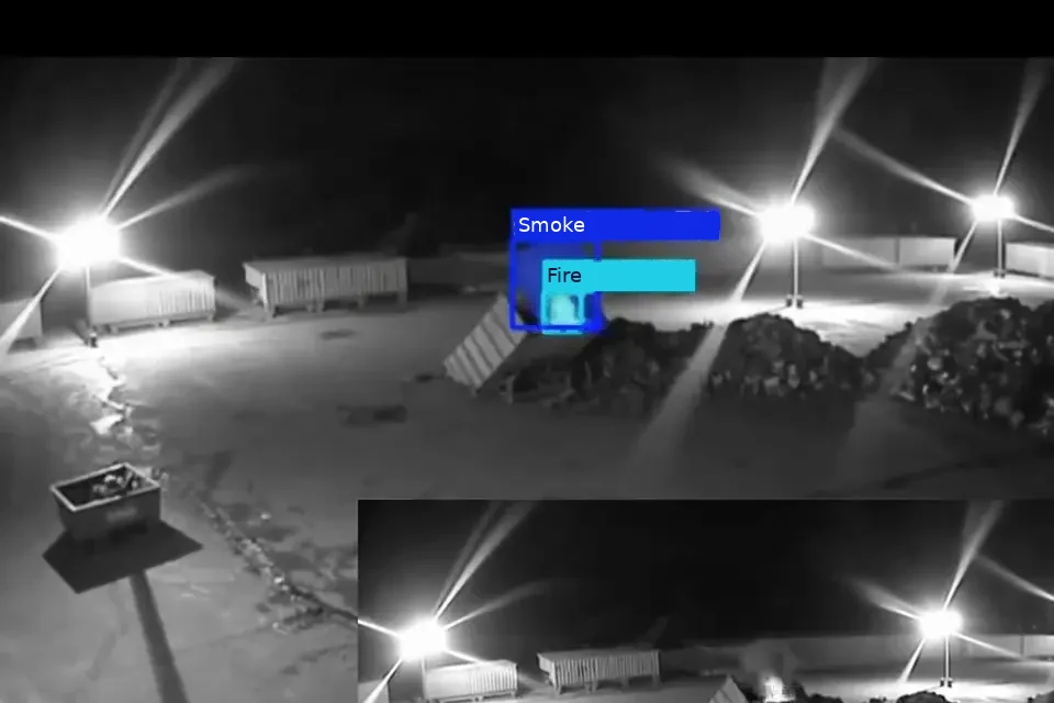 CCTV still of smoke and flame at night