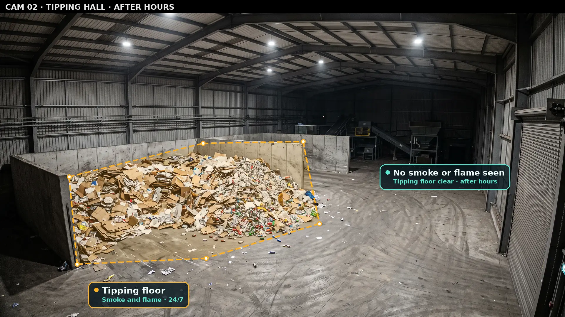 Camera view of an empty tipping hall after hours with a zone over the waste pile